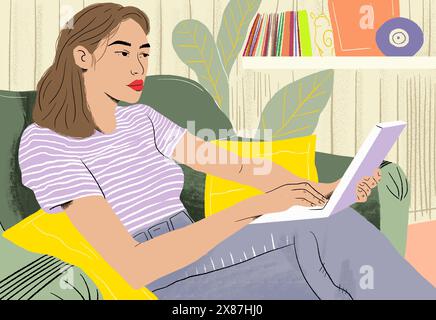 Relaxed businesswoman using laptop sitting on sofa working at home Stock Photo