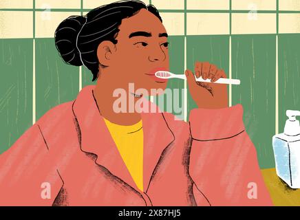 Woman brushing teeth in bathroom Stock Photo