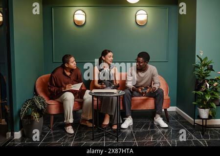 Diverse business colleagues discussing in office Stock Photo