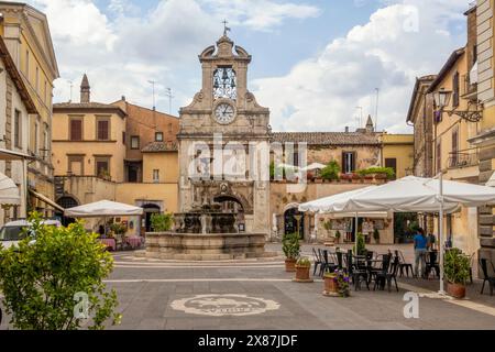 City gate amidst buildings at Piazza del Comune in Sutri, Viterbo province, Lazio, Italy Stock Photo