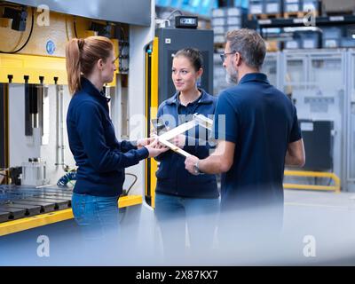 Engineers discussing in meeting at metal industry Stock Photo