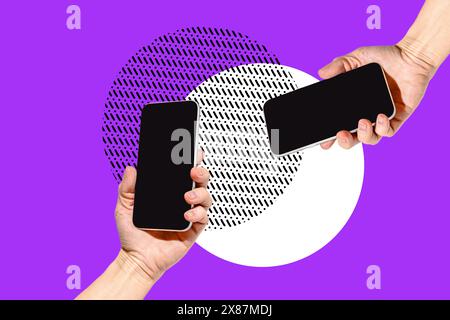 Two hands holding smart phones over violet background Stock Photo