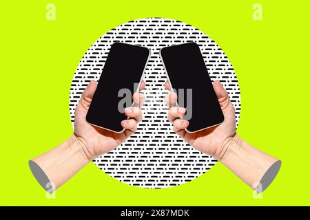 Two hands with smart phones on bright green background Stock Photo