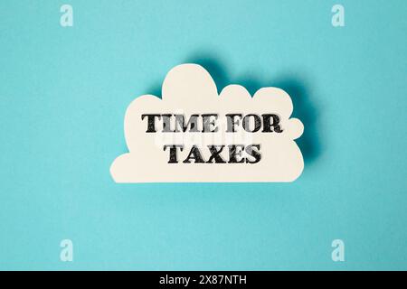 A white cloud with the word time for taxes written in black Stock Photo