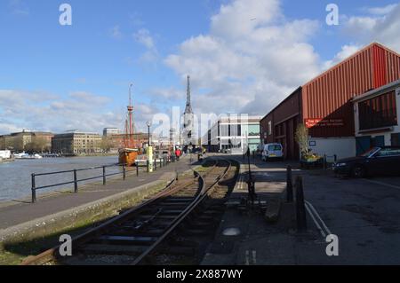 Tracks of the Bristol Harbour Railway looking down towards M Shed and The Matthew ship. 26th February 2024. Stock Photo