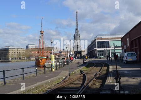 Tracks of the Bristol Harbour Railway looking down towards M Shed and The Matthew ship. 26th February 2024. Stock Photo