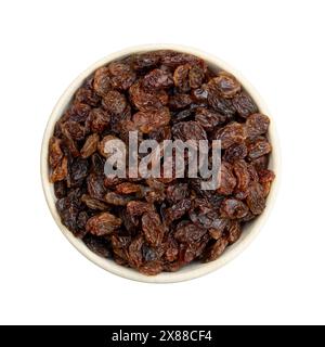 raisins on a white background in a bowl Stock Photo