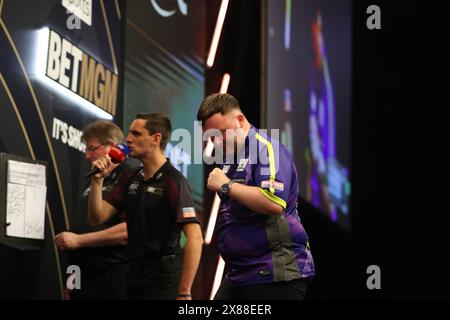 Luke Humphries celebrates winning a leg during the BetMGM Premier ...