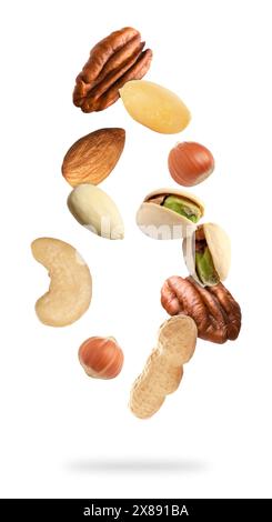 Many different nuts in air on white background Stock Photo