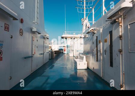 A deck atop the Gozo Channel Ferry on a sunny afternoon in Malta, connecting passengers and vehicles between Gozo island and the mainland Stock Photo