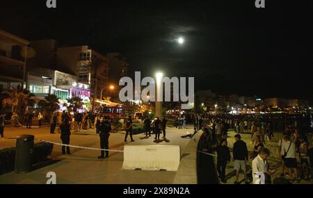 Palma, Spain. 24th May, 2024. Tourists and locals watch rescue work after the collapse of a terrace, which killed at least four people and injured fifteen, in the tourist area of Arenal beach in Mallorca. Credit: Clara Margais/dpa/Alamy Live News Stock Photo