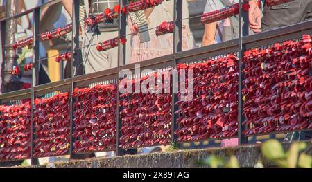 A wishing wall covered with red wish padlocks in Colmar, Alsace, France Stock Photo