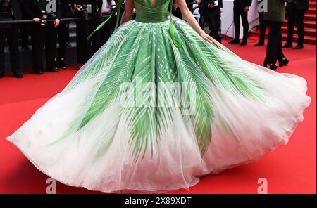 Cannes, France. 23rd May, 2024. A guest arrives for the screening of the film 'L'Amour Ouf' (Beating Hearts) at the 77th edition of the Cannes Film Festival in Cannes, southern France, on May 23, 2024. Credit: Gao Jing/Xinhua/Alamy Live News Stock Photo