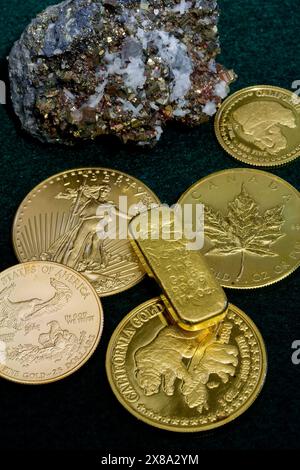 Pure gold rounds and bar - Precious metal. Calcite in Pyrite specimen from Mexico - Rocks and Minerals Stock Photo