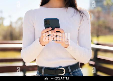 unrecognizable woman using mobile phone Stock Photo