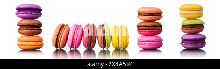 Stack of french colorful macaroons in row isolated on white background with clipping path. Stock Photo