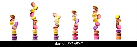 Set of flying french colorful macaroons isolated on white background. Stock Photo