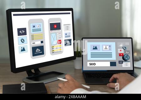 Creative web content design studio with flying website page layout seo technology businessman hand design on laptop designs for mobile app Stock Photo