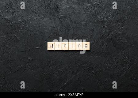 hiring word written on wood block. hiring text on table, concept. Stock Photo