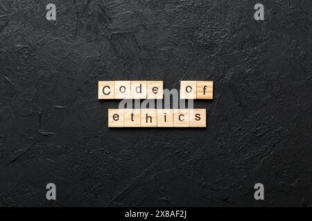 code of ethics word written on wood block. code of ethics text on table, concept. Stock Photo