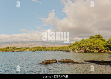 Hawaiian Coast Line at Sun Sets with Vibrant Greens and Blue Ocean Stock Photo