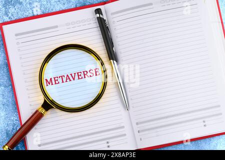 New Decentralized Internet - Smart Contract and Crypto Currency. Metaverse word through a magnifying glass in a business notebook. Stock Photo