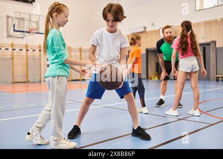 A diverse group of young children playing basketball with enthusiasm and energy in a vibrant setting. Stock Photo