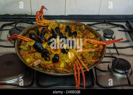 Close- up of a seafood paella in a paella pan. Image of the Spanish Mediterranean gastronomy Stock Photo