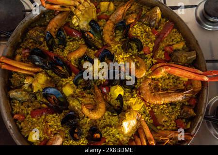 Close- up of a seafood paella in a paella pan. Image of the Spanish Mediterranean gastronomy Stock Photo