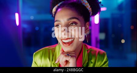 Woman, night and excited in office with neon, tablet or scroll for reading with problem solving at coding job. Person, girl and developer with click Stock Photo