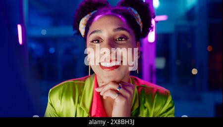 Woman, night and excited in office with neon, tablet or scroll for reading with problem solving at coding job. Person, girl and developer with click Stock Photo