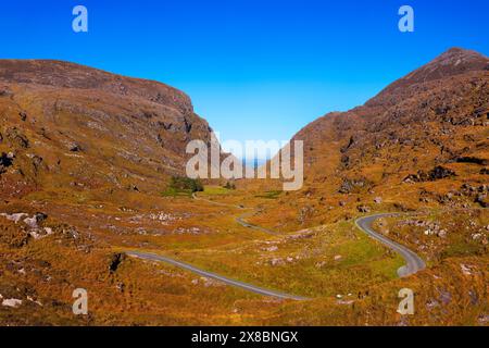 The narrow country road through the Gap of Dunloe, part of the Ring of Kerry, County Kerry, Ireland. Stock Photo