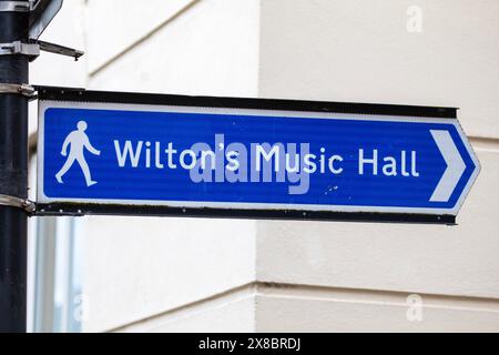 A sign showing the direction to the historic Wiltons Music Hall in East London, UK. Stock Photo