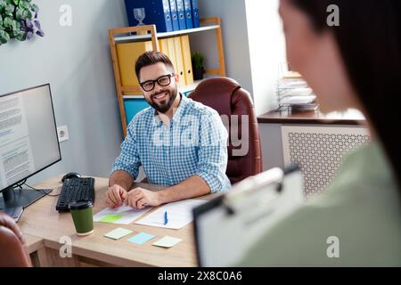 Photo of positive good mood employers dressed shirts starting new working tasks together indoors workshop workstation Stock Photo