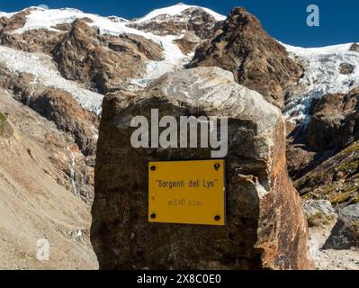 The Lys Spring plaque near the glacier and lake, in the high mountains of Monte Rosa massif. Stock Photo