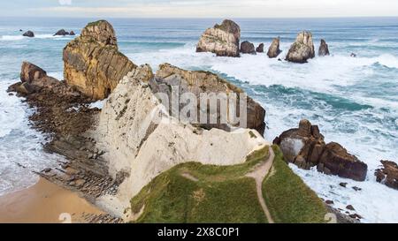 Aerial view of rock formations and sharp cliffs along the coastline near Portio Beach. Atlantic Ocean, Costa Quebrada, Cantabria, Spain Stock Photo