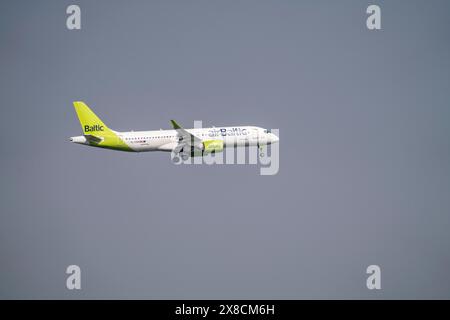 Air Baltic Airbus A220-300 approaching Düsseldorf Airport, NRW, Germany Stock Photo