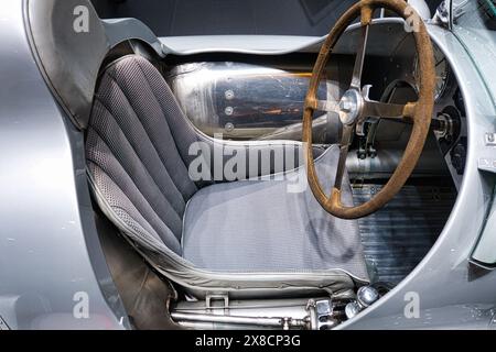 Retro charm: racing car seat with leather steering wheel from bygone times, germany, essen, techno-classica, classic car fair Stock Photo