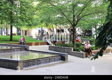 Green and sunny Pancras Square in the middle of contemporary office developments at Kings Cross, in north London, UK Stock Photo