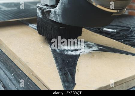 closeup shot of a milling machine working on carbon fiber guitar in the factory. High quality photo Stock Photo
