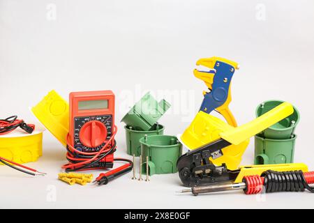 Different electrician's tools on light background Stock Photo
