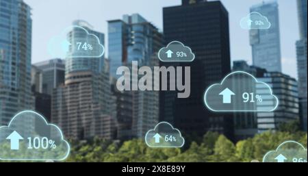 Image of growing numbers with up arrows in clouds over modern buildings in background Stock Photo