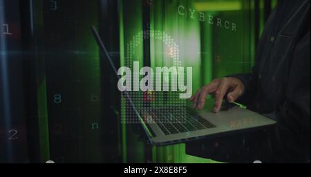 Image of cloud and data processing over asian man using laptop Stock Photo
