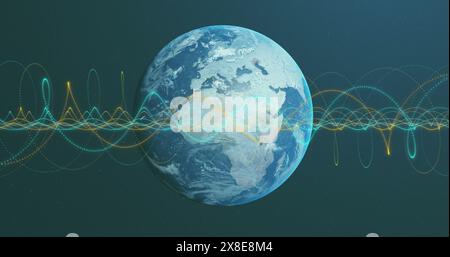 Image of illuminated spiral patterns over rotating globe against black background Stock Photo
