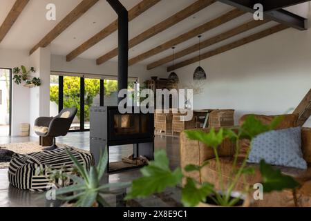 At home, sunlight streaming through large windows, warming room Stock Photo