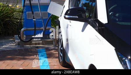 Image of statistical data processing over electric car charging at a charging station Stock Photo