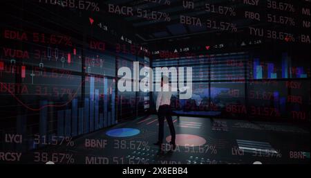 Caucasian male, wearing white shirt, analyzing stock market data Stock Photo