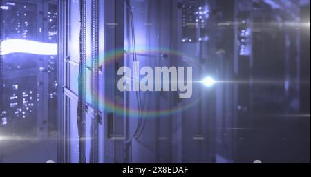 Rows of server racks glowing with blue lights in data center Stock Photo