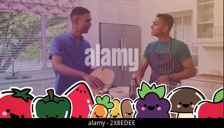 Two biracial men cooking together, one cutting vegetables Stock Photo