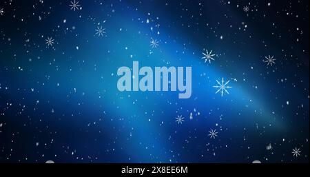 Image of snowflakes icons falling over blue background with copy space Stock Photo